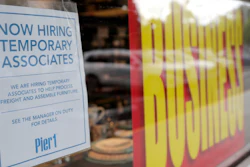 A sign advertises hiring of temporary associates at a Pier 1 retail store in Coral Gables, Fla., Aug. 6, 2020.