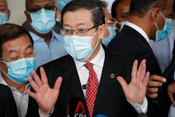 Former finance minister Lim Guan Eng speaks to media outside a courthouse in Kuala Lumpur, Aug. 7, 2020.