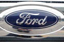 The company logo shines at a Ford dealership in Littleton, Colo.