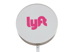 Lyft sign at a shared ride pickup location in Detroit, March 24, 2020.