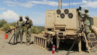 Soldiers of the U.S. Army 3-43 ADA Regiment setting up the Integrated Fire Control Relay in preparation for the IBCS Limited User Test flight test at White Sands Missile Range, New Mexico.