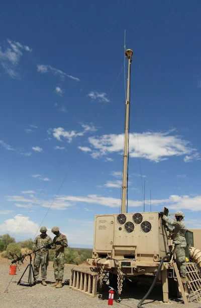 Soldiers of the U.S. Army 3-43 ADA Regiment setting up the Integrated Fire Control Relay in preparation for the IBCS Limited User Test flight test at White Sands Missile Range, New Mexico.