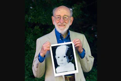 In this 2007 file photo, Russell Kirsch holds the image of his son, Walden, that was scanned into the world's first digital scanner in 1957.