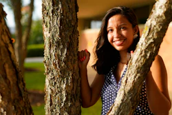 Megan Foster poses for a picture on the campus of the University of North Carolina-Charlotte on Saturday, Aug. 1, 2020, in Charlotte, N.C. The iconic summer job for high school and college students has been on the wane for nearly 20 years. But the pandemic is squeezing even more young people out of the workforce. Foster, a grad student, was unable to get a paid internship or summer job in her field of communications.