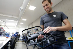 Adam Bry, founder and CEO of Skydio, holds the R1 flying camera drone while being interviewed in Redwood City, Calif., June 22, 2018.
