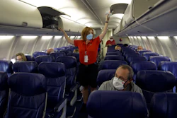 A Southwest Airlines flight attendant prepares for takeoff at Kansas City International Airport, Kansas City, Mo., May 24, 2020.