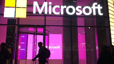 People walk past a Microsoft office in New York, Nov. 10, 2016.