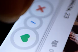 A man uses the dating app Tinder in New Delhi, India, July 5, 2015.