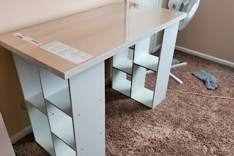 In this photo provided by Megan Fry, a desk Fry constructed out of a legless tabletop and bookcases stands in her Indianapolis home on Sept. 14, 2020.