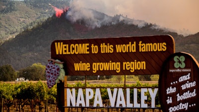 An air tanker drops retardant on the Glass Fire burning in Calistoga, CA on Sunday, Sept. 27.