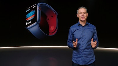 In this still image provided by Apple from the keynote video of a special event at Apple Park in Cupertino, Calif., Apple's Chief Operating Officer Jeff Williams unveils Apple Watch Series 6 on Tuesday, Sept. 15, 2020. Apple is introducing the cheaper version of its smart watch in its latest attempt to broaden the appeal of its trend-setting products while more consumers are forced to scrimp during ongoing fallout from the pandemic.