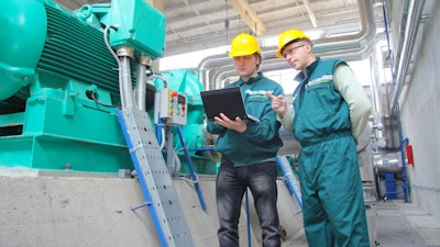 Industrial Workers With Notebook 000050189250 Small