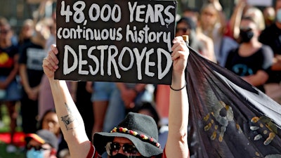 Protesters rally outside the Rio Tinto office after the destruction of Australian Indigenous sacred sites in Perth.