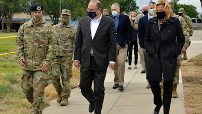 Marshall Billingslea, center, special presidential envoy for arms control, and National Nuclear Security Administration Administrator Lisa Gordon-Hagerty, right, walk with Air Force personnel at Kirtland Air Force Base, Albuquerque, Sept. 9, 2020.