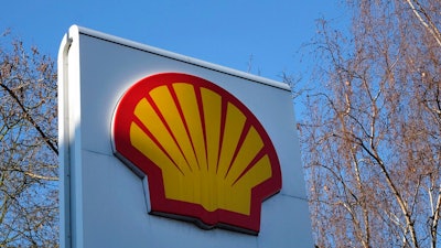 This Wednesday, Jan. 20, 2016 file photo, shows the Shell logo at a petrol station in London. Royal Dutch Shell said Wednesday Sept. 30, 2020, it is planning to cut between 7,000 and 9,000 jobs worldwide by the end of 2022 following a collapse in demand for oil and a subsequent slide in oil prices during the coronavirus pandemic.