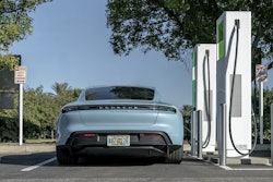 A 2020 Porsche Taycan at a public charging station.