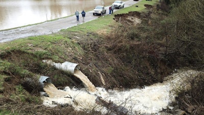 Officials monitor a potential dam/levee failure in the Springridge Place subdivision in Yazoo County, Miss., Feb. 11, 2020.