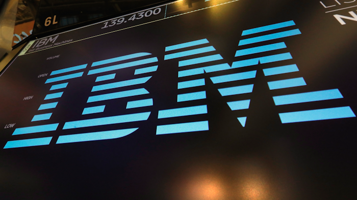 In this March 18, 2019, file photo, the logo for IBM appears above a trading post on the floor of the New York Stock Exchange. IBM says it is breaking off a $19 billion chunk of its business to focus on cloud computing. The 109-year-old tech company said Thursday, Oct. 8, 2020, it is spinning off its managed infrastructure services unit into a new public company, temporarily named NewCo.
