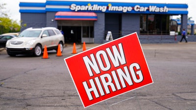 A help wanted sign is displayed at car wash in Indianapolis.