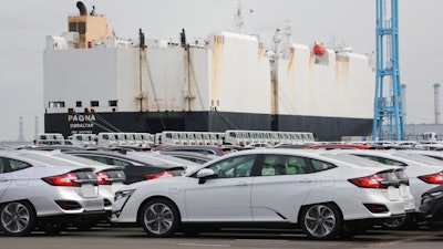 Cars are parked to be exported at Yokohama port, near Tokyo.