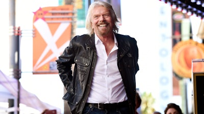 In this Oct. 16, 2018 file photo, Richard Branson appears at a ceremony honoring him with a star on the Hollywood Walk of Fame, in Los Angeles. Virgin Hyperloop One will build a certification center in West Virginia to test the high-speed transportation concept that uses enclosed pods to zip passengers underground at over 600 mph (966 kph). The company had received bids from 17 states in 2020 to build a 6-mile testing track and other facilities over hundreds of acres for its electromagnetic levitation transportation technology.