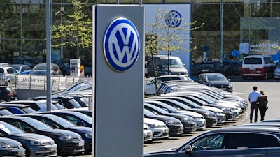 Cars are lined up at a Volkswagen car dealer in Essen, Germany.