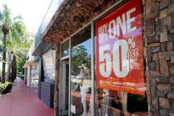 A business displays a 'Buy One Get One 50% Off,' sign Monday, Oct. 12, 2020, in Surfside, Fla. U.S. consumer prices rose slightly in September, led again by sharp increases in the index for used vehicles. The Labor Department reported Tuesday, Oct. 13 that the consumer price index rose 0.2% last month.