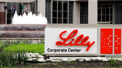 This is an April 26, 2017, file photo showing Eli Lilly corporate headquarters in Indianapolis. Eli Lilly continues to back a potential COVID-19 treatment despite research showing that it may not work on hospitalized patients. The drugmaker said Tuesday, Oct. 27, 2020, that It remains confident that its drug may stop COVID from developing in other patients.