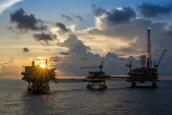 A silhouette of oil and gas production platforms in the South China Sea.