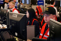 In this Oct. 10, 2019, file photo, Pacific Gas & Electric employees work in the PG&E Emergency Operations Center in San Francisco. When Pacific Gas & Electric set up emergency operations centers to coordinate intentional blackouts intended to prevent wildfires in Northern California, the nation's largest utility forgot one thing, emergency managers who knew the fundamentals of emergency management in California.