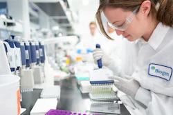 A Biogen scientist works on Alzheimer’s disease research in a laboratory at the drugmaker’s headquarters in Cambridge, Mass., Dec. 12, 2019.
