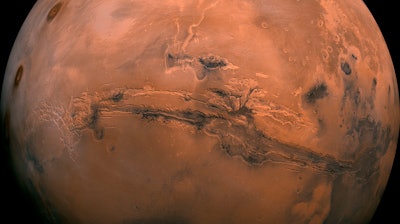 This image made available by NASA shows the planet Mars. This composite photo was created from over 100 images of Mars taken by Viking Orbiters in the 1970s. NASA is underestimating the amount of time and money it will take to bring Mars rocks back to Earth in the coming decade, an independent panel said Tuesday, Nov. 10, 2020.