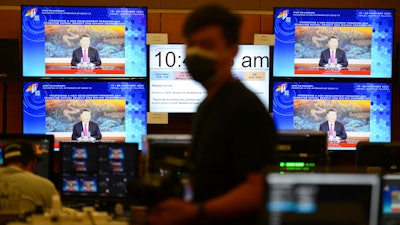 Monitors show Chinese President Xi Jinping via virtual meeting during the APEC CEO Dialogues 2020, Kuala Lumpur, Nov. 19, 2020.