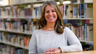 Middle school counselor Sam Baker in the school's library in Sammamish, Wash., Nov. 18, 2020.
