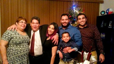 This December 2015 family photo shows Jose Pereira, second left, one of the Houston-based Citgo oil executives convicted and ordered to prison in Venezuela, pictured with his wife Mervis, from left, and children, Sara, John, unidentified grandson and Joao, in Houston, Texas.