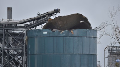 The warehouse where emergency services attend to a large explosion in Bristol, England, Thursday Dec. 3, 2020. A local British emergency services department says there have been “multiple casualties” following a large explosion at a warehouse near the southwest England city of Bristol.