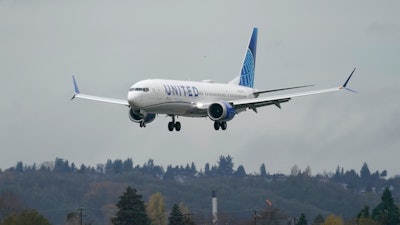 This Nov. 18, 2020, file photo shows a Boeing 737 Max 9 built for United Airlines landing at King County International Airport - Boeing Field after a test flight from Moses Lake, Wash., in Seattle.