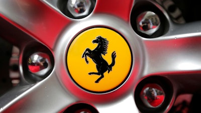 Ferrari logo on a car outside the New York Stock Exchange.