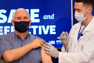 Vice President Mike Pence receives a Pfizer-BioNTech COVID-19 vaccine shot at the Eisenhower Executive Office Building on the White House complex, Friday, Dec. 18, 2020, in Washington. Karen Pence, and U.S. Surgeon General Jerome Adams also participated.