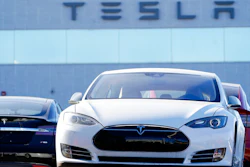 An unsold 2021 S70 sedan sits at a Tesla dealership.