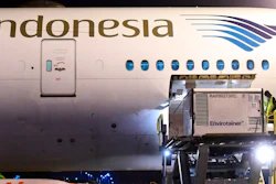 In this photo released by Indonesian Presidential Palace, workers unload a container containing experimental coronavirus vaccines made by Chinese company Sinovac from the cargo bay of a Garuda Indonesia plane at the Soekarno-Hatta International Airport in Tangerang, Indonesia, late Sunday, Dec. 6, 2020. Indonesia's government said more than a million doses of an experimental COVID-19 vaccine developed by China-based biopharmaceutical company Sinovac Biotech arrived in the country late Sunday and more are expected to arrive in early January.