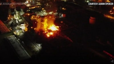 An explosion at a West Virginia chemical plant on Tuesday night prompted authorities to order residents within 2 miles of the plant to remain indoors. A local official said four people were injured.