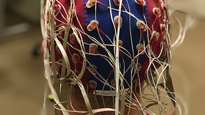 Purdue University researchers are doing work at the intersection of artificial intelligence and neuroscience. In this photo, a research participant is wearing an EEG cap with electrodes.