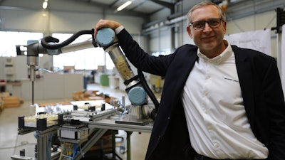 Jürgen von Hollen, president of Universal Robots, delivered the company's 50,000th cobot.