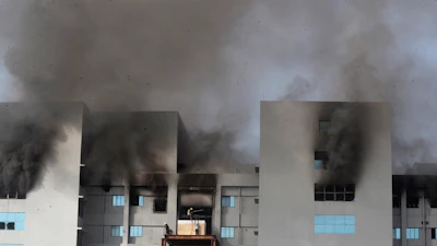 Firemen try to douse a fire at Serum Institute of India, the world's largest vaccine maker that is manufacturing the AstraZeneca/Oxford University vaccine for the coronavirus, in Pune, India, Thursday, Jan. 21, 2021.