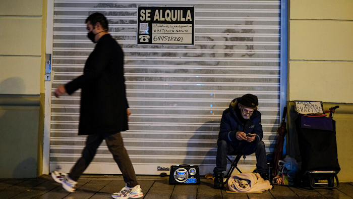 A homeless with his dog in Pamplona, Spain, Jan. 21, 2021.