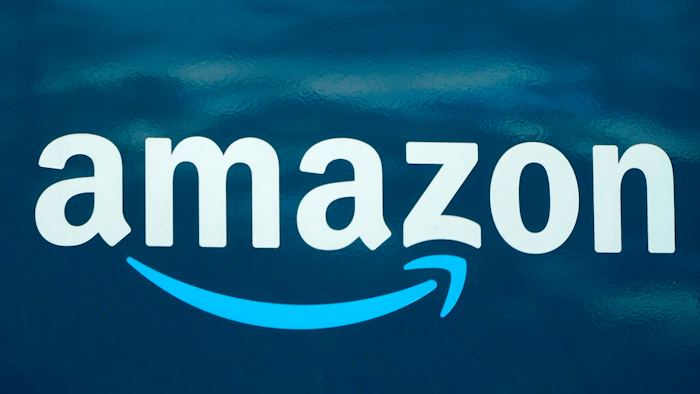 In this Oct. 1, 2020 file photo, an Amazon logo appears on an Amazon delivery van in Boston. Amazon continues to grow, with plans to add more than 3,000 jobs in Boston over the next several years. The company said Tuesday, Jan. 26, 2021, that expansion plans for its Boston Tech Hub will bring new jobs for units including Alexa, Amazon Web Services, Amazon Robotics, and Amazon Pharmacy.