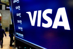 Visa logo above a trading post on the floor of the New York Stock Exchange, April 23, 2018.
