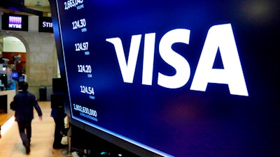 Visa logo above a trading post on the floor of the New York Stock Exchange, April 23, 2018.