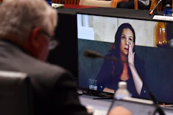Mel Silva, right, managing director of Google Australia and New Zealand, appears via a video link during a Senate inquiry into a mandatory code of conduct, Parliament House, Canberra, Jan. 22, 2021.
